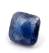 A faceted cushion-cut blue gemstone, likely a sapphire, shown on a clean white background.