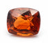 A cushion-cut faceted gemstone with a warm amber-orange color and reddish-brown undertones, shown on a plain white background.
